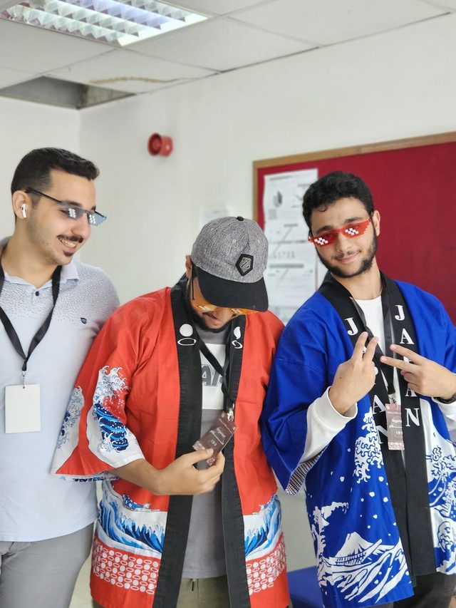 Members trying on happi coats at the club's Japanese workshop